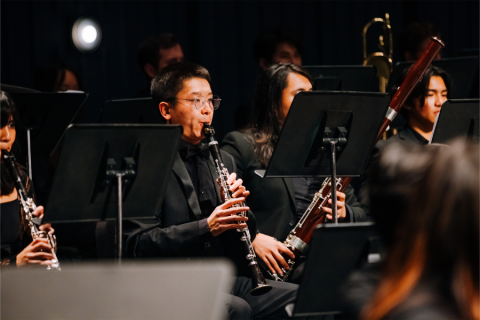 Woodwind player on stage during concert
