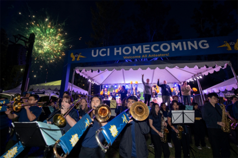 Marching band playing at night outdoors