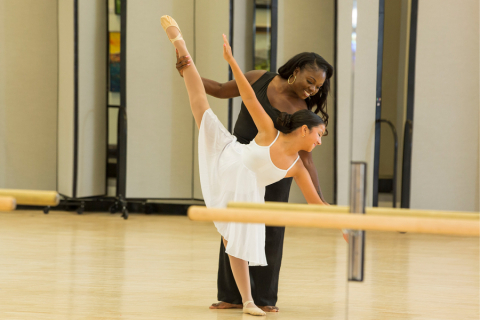 Dance teacher with ballet student